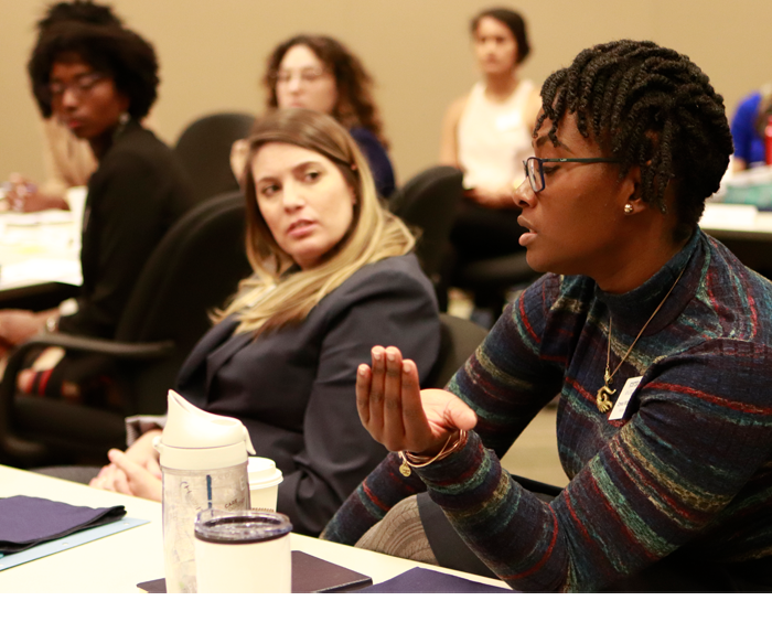 Group of women in conversation at a conference