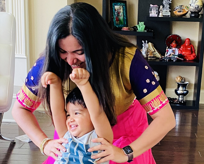 Mother and young boy play at home 